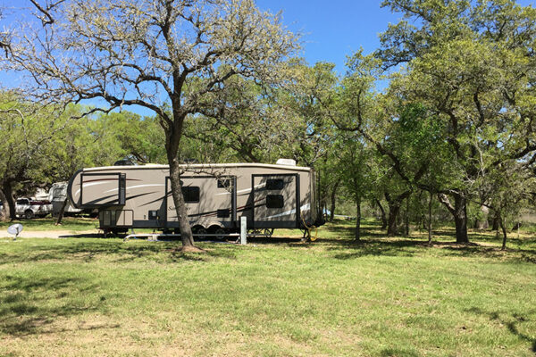 RV-Parked-Amongst-Trees-At-Our-RV-Park-In-San-Antonio